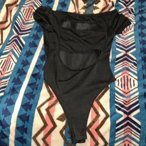 Black tube top body suit, selling because it’s too big
